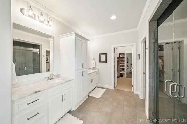 5918 E 127th Pl S, Tulsa, OK 74008 - full bathroom featuring vanity, crown molding, a walk in closet, a stall shower, and recessed lighting