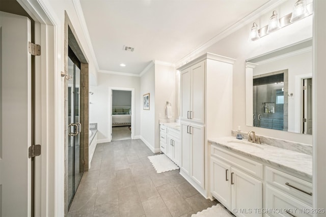 5918 E 127th Pl S, Tulsa, OK 74008 - bathroom with two vanities, a shower stall, connected bathroom, crown molding, and recessed lighting