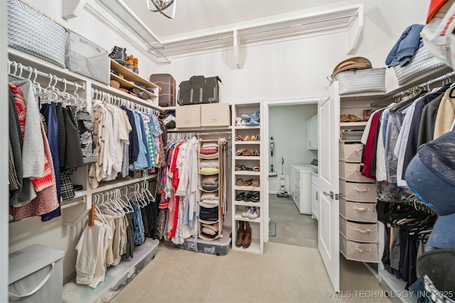 5918 E 127th Pl S, Tulsa, OK 74008 - spacious closet featuring washing machine and clothes dryer and carpet floors