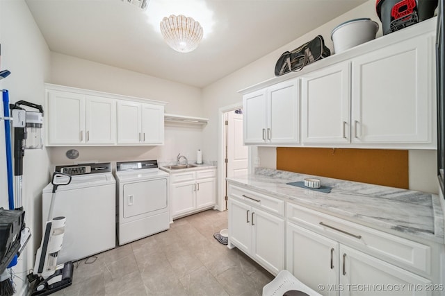 5918 E 127th Pl S, Tulsa, OK 74008 - laundry area with cabinet space, washing machine and clothes dryer, and light tile patterned flooring