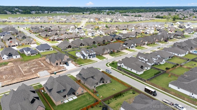 5918 E 127th Pl S, Tulsa, OK 74008 - aerial overview of property's location featuring a large body of water and nearby suburban area