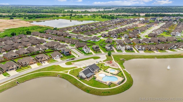 5918 E 127th Pl S, Tulsa, OK 74008 - aerial view of property and surrounding area with a large body of water, a pool area, and nearby suburban area