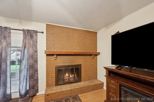 3823 S 88th E Pl, Tulsa, OK 74145 - living room featuring a fireplace, wood finished floors, and crown molding