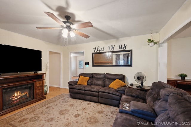 3823 S 88th E Pl, Tulsa, OK 74145 - living area featuring ceiling fan, wood finished floors, and a glass covered fireplace