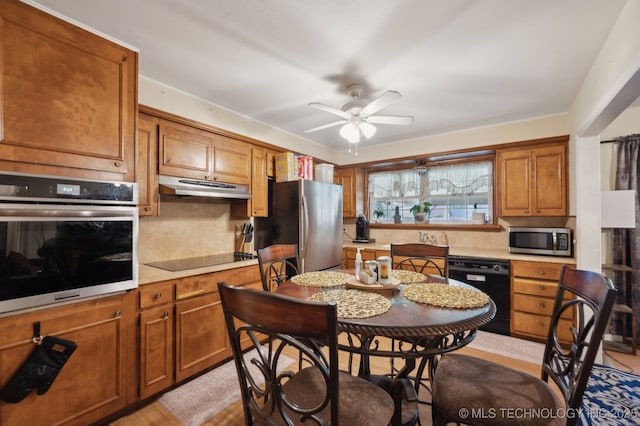 3823 S 88th E Pl, Tulsa, OK 74145 - kitchen featuring black appliances, under cabinet range hood, light countertops, and ceiling fan