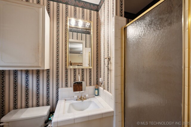 3823 S 88th E Pl, Tulsa, OK 74145 - full bathroom featuring wallpapered walls, toilet, a shower stall, and vanity