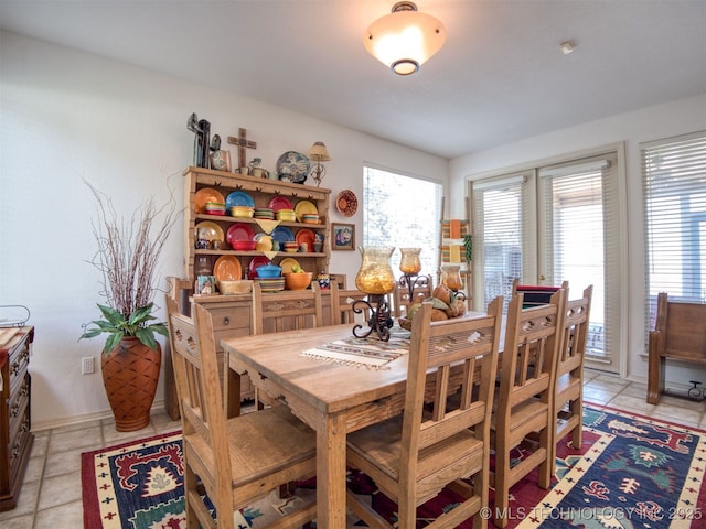 5168 Tower Dr, Kingston, OK 73439 - dining room with light tile patterned flooring and baseboards