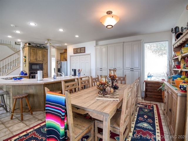 5168 Tower Dr, Kingston, OK 73439 - dining area with stairway, recessed lighting, ceiling fan, and light tile patterned flooring