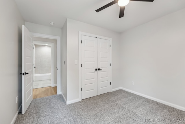 1448 N Main St Unit 2, Tulsa, OK 74106 - unfurnished bedroom with carpet, a closet, baseboards, and a ceiling fan