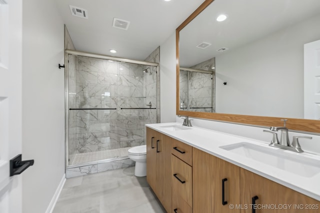 1448 N Main St Unit 2, Tulsa, OK 74106 - bathroom with toilet, recessed lighting, double vanity, a marble finish shower, and marble look tiles