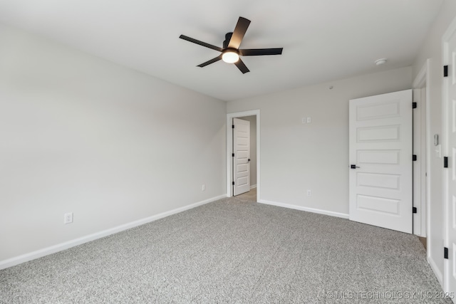 1448 N Main St Unit 2, Tulsa, OK 74106 - unfurnished bedroom featuring carpet flooring, baseboards, and ceiling fan