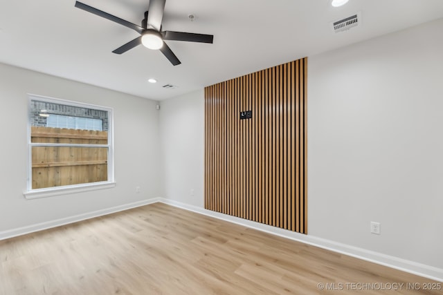 1448 N Main St Unit 2, Tulsa, OK 74106 - empty room with a ceiling fan, wood finished floors, recessed lighting, baseboards, and fire sprinkler in ceiling