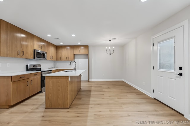 1448 N Main St Unit 2, Tulsa, OK 74106 - kitchen with appliances with stainless steel finishes, light countertops, a sink, a chandelier, and recessed lighting