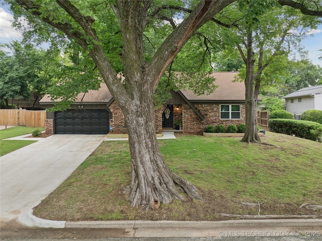 5235 S Zunis Pl, Tulsa, OK 74105 - view of front of house featuring roof with shingles, brick siding, a garage, and driveway