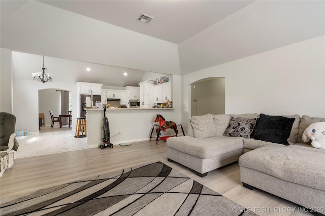 1105 N Joshua Ave, Broken Arrow, OK 74012 - living room with arched walkways, a chandelier, light wood finished floors, baseboards, and recessed lighting