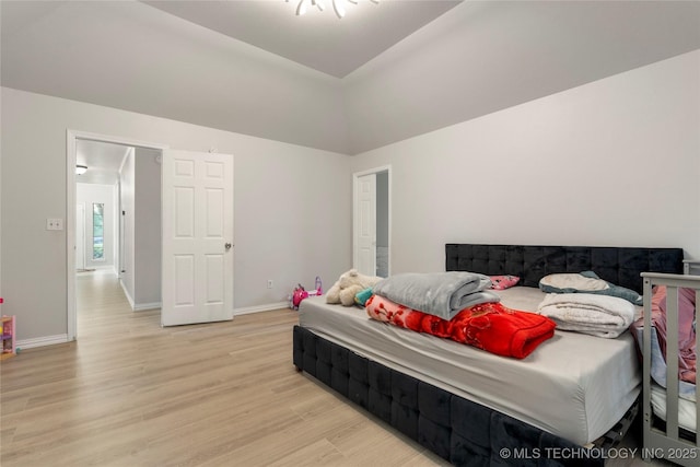 1105 N Joshua Ave, Broken Arrow, OK 74012 - bedroom featuring light wood-style floors, baseboards, and vaulted ceiling