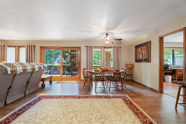 1485 Old Ketchum Rd, Langley, OK 74350 - dining area featuring wood finished floors, ceiling fan, and baseboards