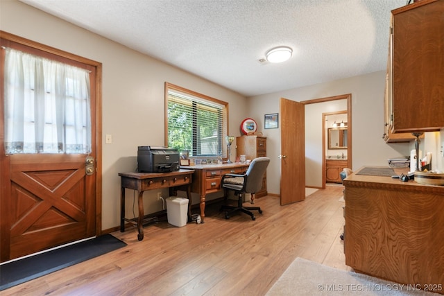 1485 Old Ketchum Rd, Langley, OK 74350 - office space with light wood-style floors, a textured ceiling, and baseboards