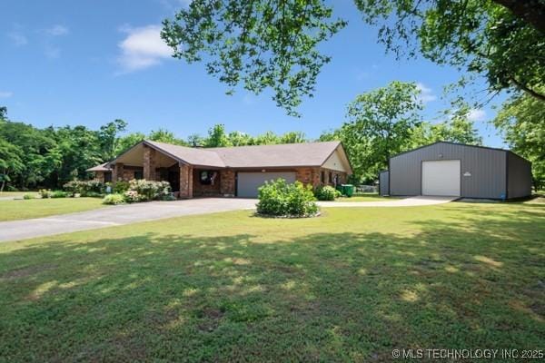 1485 Old Ketchum Rd, Langley, OK 74350 - ranch-style home featuring a front lawn, driveway, an outbuilding, and a detached garage