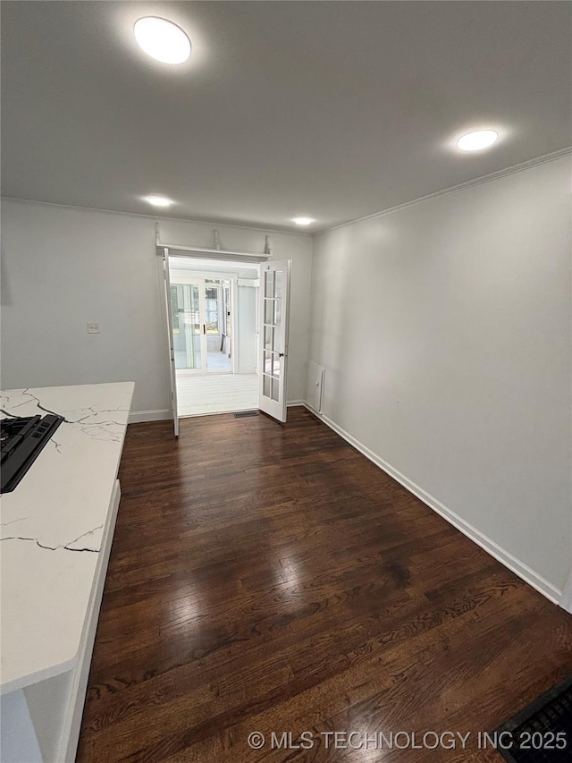4607 E 4th Pl, Tulsa, OK 74112 - unfurnished room featuring dark wood-style floors, baseboards, and french doors