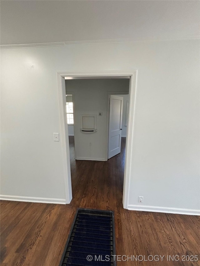4607 E 4th Pl, Tulsa, OK 74112 - corridor featuring baseboards, wood finished floors, and crown molding