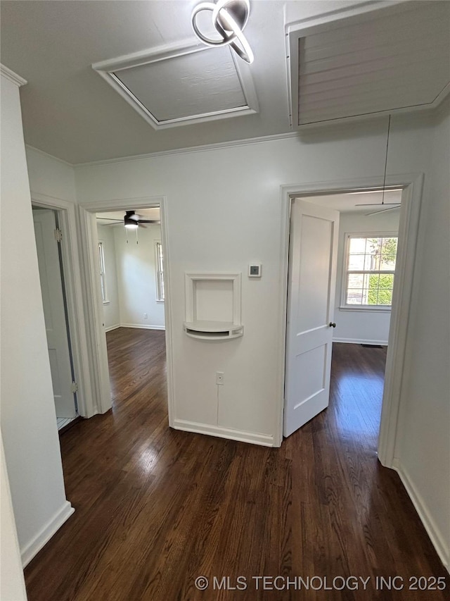 4607 E 4th Pl, Tulsa, OK 74112 - hallway featuring dark wood-style flooring, attic access, and baseboards