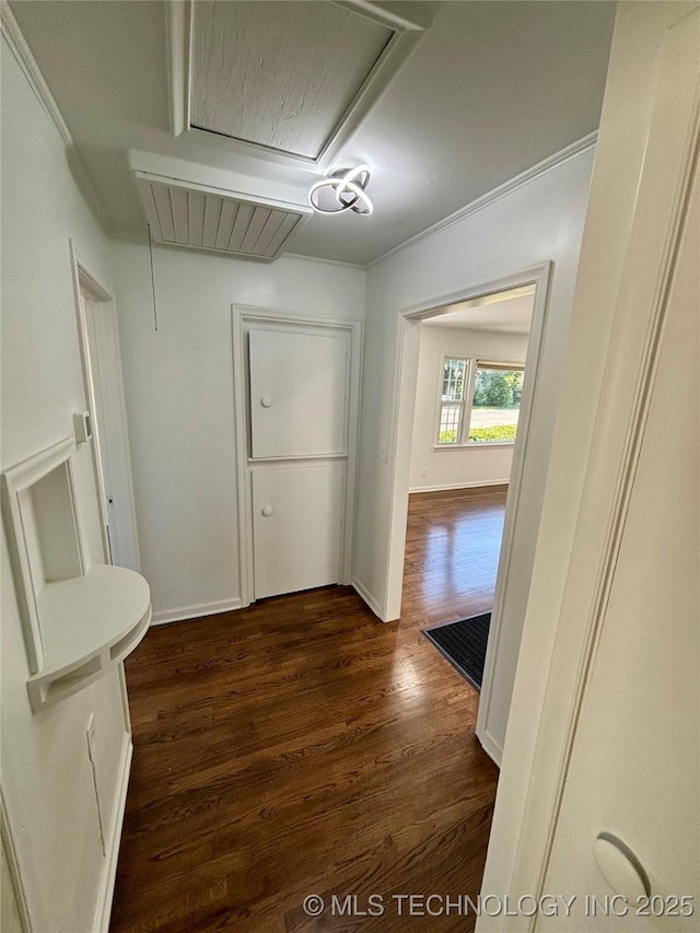 4607 E 4th Pl, Tulsa, OK 74112 - hall featuring attic access, dark wood finished floors, crown molding, and baseboards