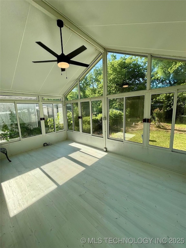 4607 E 4th Pl, Tulsa, OK 74112 - unfurnished sunroom with a ceiling fan and vaulted ceiling