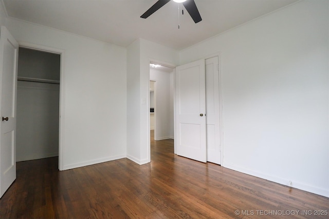 4607 E 4th Pl, Tulsa, OK 74112 - unfurnished bedroom featuring wood finished floors, a closet, and a ceiling fan