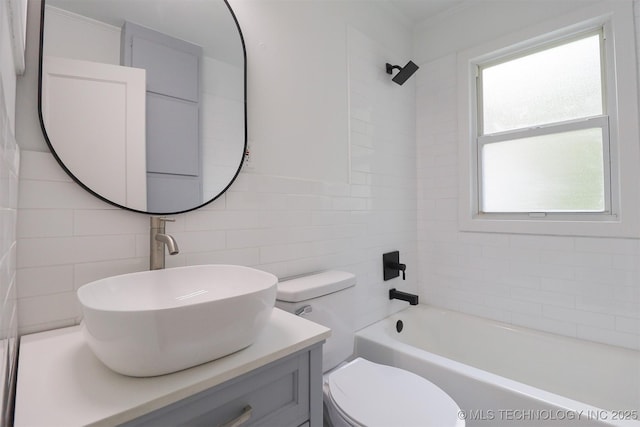 4607 E 4th Pl, Tulsa, OK 74112 - bathroom with vanity, tile walls,  shower combination, ornamental molding, and tasteful backsplash