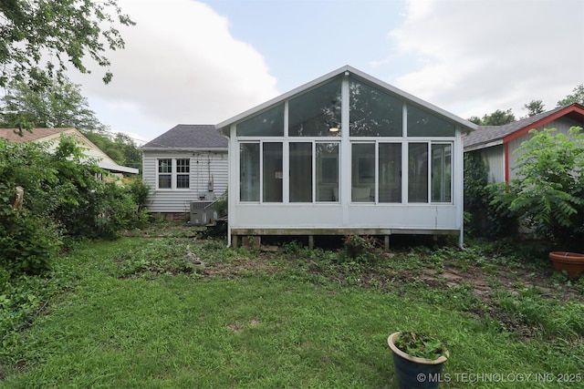 4607 E 4th Pl, Tulsa, OK 74112 - rear view of property featuring a sunroom