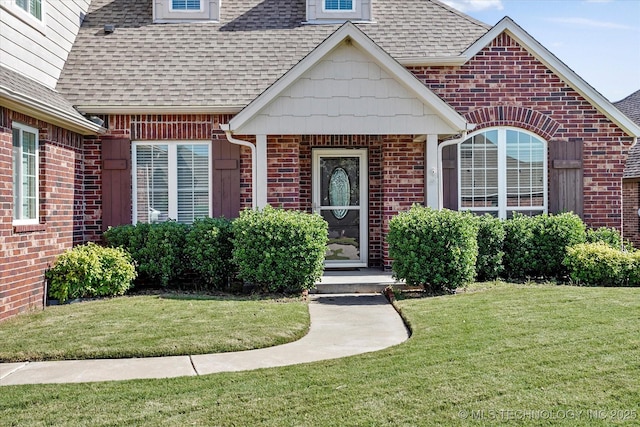 1620 E Granger St, Broken Arrow, OK 74012 - doorway to property with roof with shingles, a yard, and brick siding
