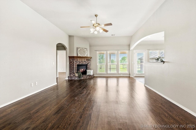 1620 E Granger St, Broken Arrow, OK 74012 - unfurnished living room featuring ceiling fan, a fireplace, baseboards, dark wood-style flooring, and lofted ceiling
