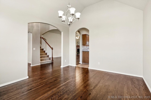 1620 E Granger St, Broken Arrow, OK 74012 - spare room with a chandelier, arched walkways, dark wood-style floors, stairway, and baseboards
