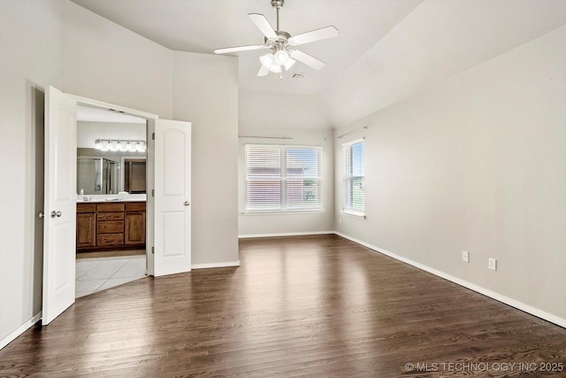 1620 E Granger St, Broken Arrow, OK 74012 - unfurnished bedroom featuring wood finished floors, baseboards, high vaulted ceiling, ensuite bathroom, and a ceiling fan