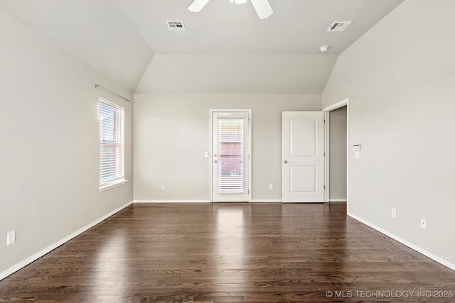 1620 E Granger St, Broken Arrow, OK 74012 - spare room featuring dark wood-style flooring, healthy amount of natural light, vaulted ceiling, ceiling fan, and baseboards