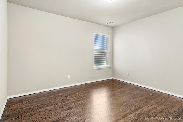 1620 E Granger St, Broken Arrow, OK 74012 - empty room featuring dark wood-type flooring and baseboards