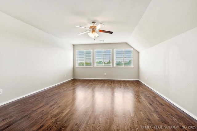 1620 E Granger St, Broken Arrow, OK 74012 - additional living space with a ceiling fan, dark wood-style flooring, baseboards, and vaulted ceiling
