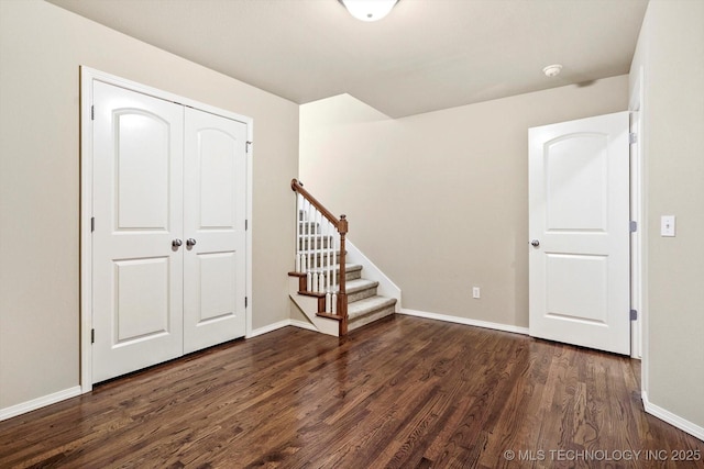 1620 E Granger St, Broken Arrow, OK 74012 - below grade area featuring dark wood finished floors, baseboards, and stairs