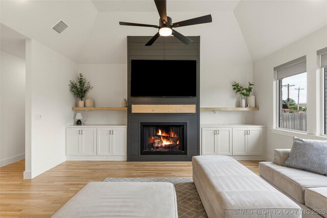 10215 E 121st Pl S, Bixby, OK 74008 - living room featuring lofted ceiling, light wood finished floors, a fireplace, ceiling fan, and baseboards