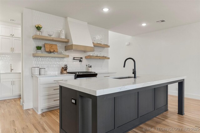 10215 E 121st Pl S, Bixby, OK 74008 - kitchen featuring a sink, gas stove, open shelves, premium range hood, and recessed lighting