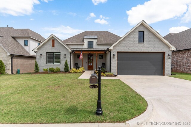 10215 E 121st Pl S, Bixby, OK 74008 - view of front of home featuring a front yard, concrete driveway, a shingled roof, brick siding, and a garage