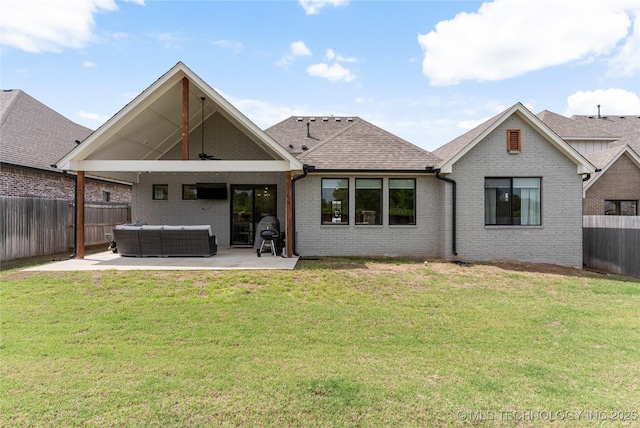 10215 E 121st Pl S, Bixby, OK 74008 - rear view of property with a patio area, an outdoor hangout area, brick siding, and roof with shingles