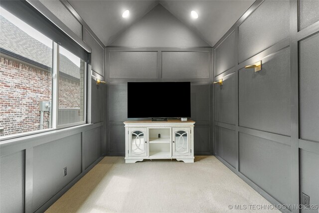 10215 E 121st Pl S, Bixby, OK 74008 - living area with a decorative wall, light carpet, vaulted ceiling, and recessed lighting