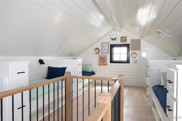 67 Lower Green Way Unit B, Carlton Landing, OK 74432 - bedroom with light wood-style flooring, wood ceiling, and wood walls