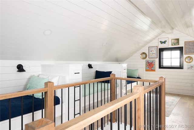 67 Lower Green Way Unit B, Carlton Landing, OK 74432 - hall featuring hardwood / wood-style floors, an upstairs landing, and wooden walls