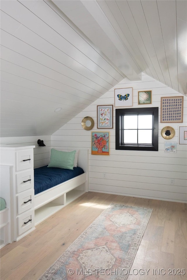 67 Lower Green Way Unit B, Carlton Landing, OK 74432 - bedroom with hardwood / wood-style flooring and wood walls