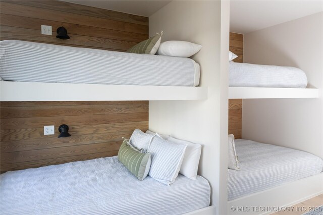 67 Lower Green Way Unit B, Carlton Landing, OK 74432 - bedroom with wooden walls