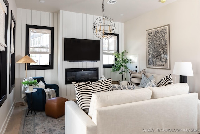 67 Lower Green Way Unit B, Carlton Landing, OK 74432 - living room with wood finished floors, a chandelier, plenty of natural light, and recessed lighting
