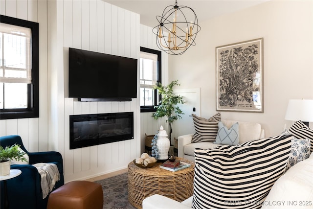67 Lower Green Way Unit B, Carlton Landing, OK 74432 - living area with a chandelier, a fireplace, and wood finished floors